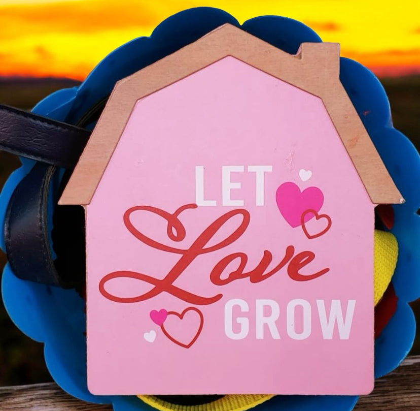 " Let love grow" sign